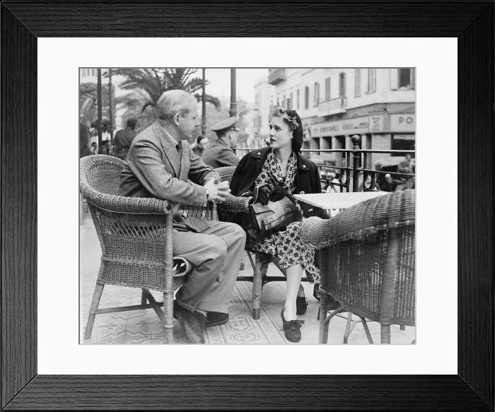 Framed Print : Clare Boothe Luce (1903-1987) on the terrace of Shepherds Hotel discussing the plans of her middle east tour with Douglas Williams, in Cairo. 1942 Framed Print : Clare Boothe Luce (1903-1987) on the terrace of Shepherds Hotel discussing the plans of her middle east tour with Douglas Williams, in Cairo. 1942
