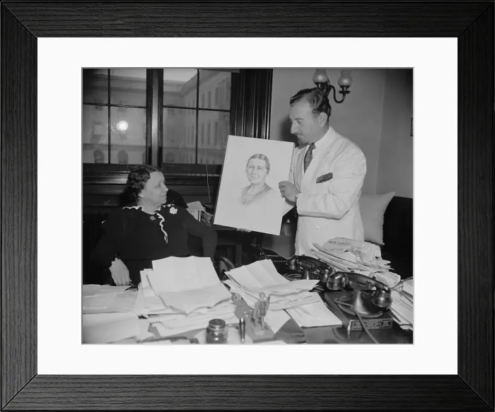 Framed Print : Senator Hattie W. Caraway, Democrat of Arkansas, choosing the official portrait for her 1937 re-election campaign