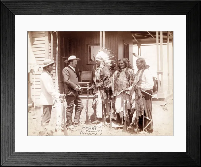 Framed Print : The Interview. Three Cheyenne men, Standing Elk, No. 1; Running Hog, No. 2; Little Wolf, No. 3, wearing ceremonial clothing and holding rifles with Col. Oelrich, No Framed Print : The Interview. Three Cheyenne men, Standing Elk, No. 1; Running Hog, No. 2; Little Wolf, No. 3, wearing ceremonial clothing and holding rifles with Col. Oelrich, No