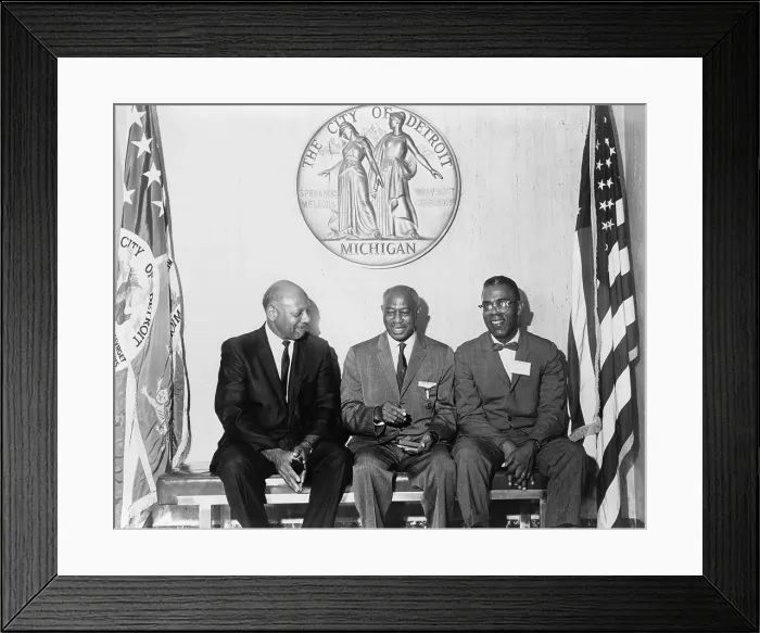 Framed Print : Three African Americans, poets Dudley Randall (1914-2000) and Melvin Beaunorus Tolson (1898-1966), with Olivier LaGroan seated on bench below seal of the Detroit, Michigan. 1965