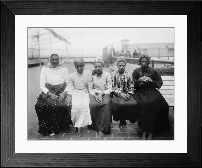 Framed Print : Barefoot women immigrants at Ellis Island are from the Caribbean. Ca. 1910