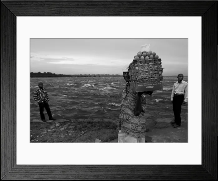 Framed Print : CONGO, Democratic Republic of the. Kinshasa. People on the banks of Congo river, opposite of Brazzaville. AISA / Everett Collection**US SALES ONLY** Framed Print : CONGO, Democratic Republic of the. Kinshasa. People on the banks of Congo river, opposite of Brazzaville. AISA / Everett Collection**US SALES ONLY**