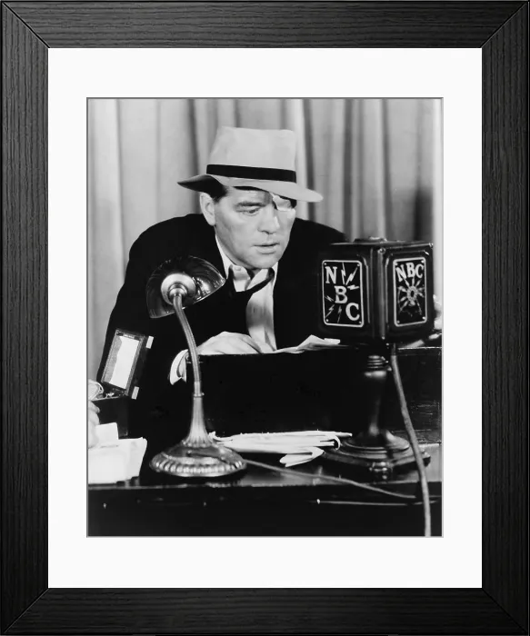 Framed Print : Floyd Gibbons (1887-1939), broadcasting news into N.B.C. Radio microphone in 1930