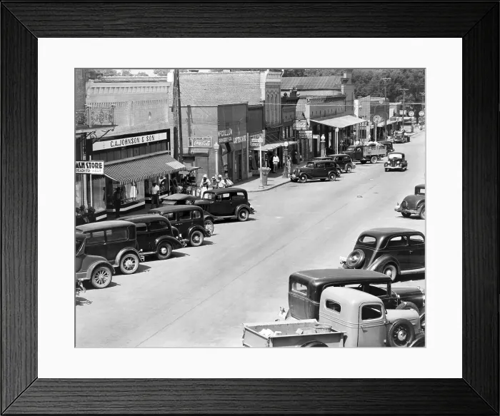 Framed Print : Main Street of Greensboro, county seat of Hale County, Alabama. Published in the book, Let Us Now Praise Famous Men'. photograph by Walker Evans, July, 1936