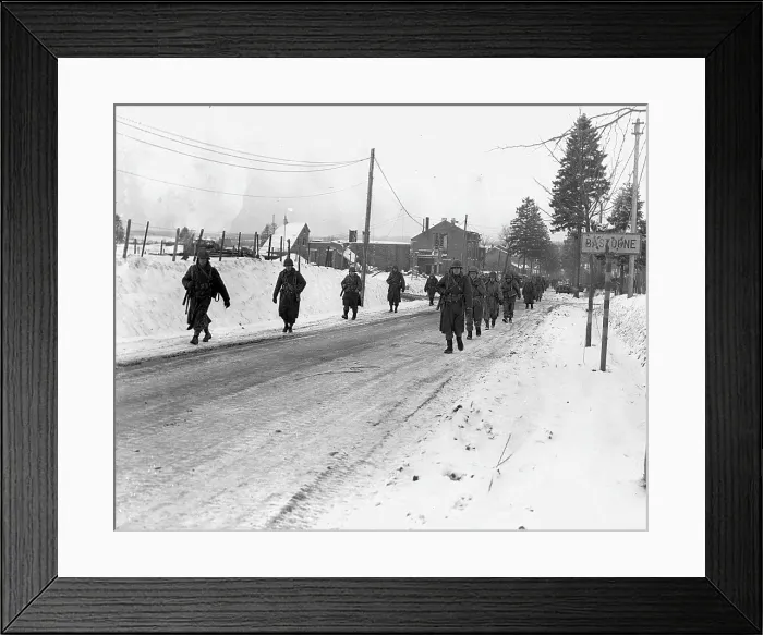 Framed Print : World War II. US Army infantrymen march on a road near Bastogne, Belgium. Dec 1944 Framed Print : World War II. US Army infantrymen march on a road near Bastogne, Belgium. Dec 1944