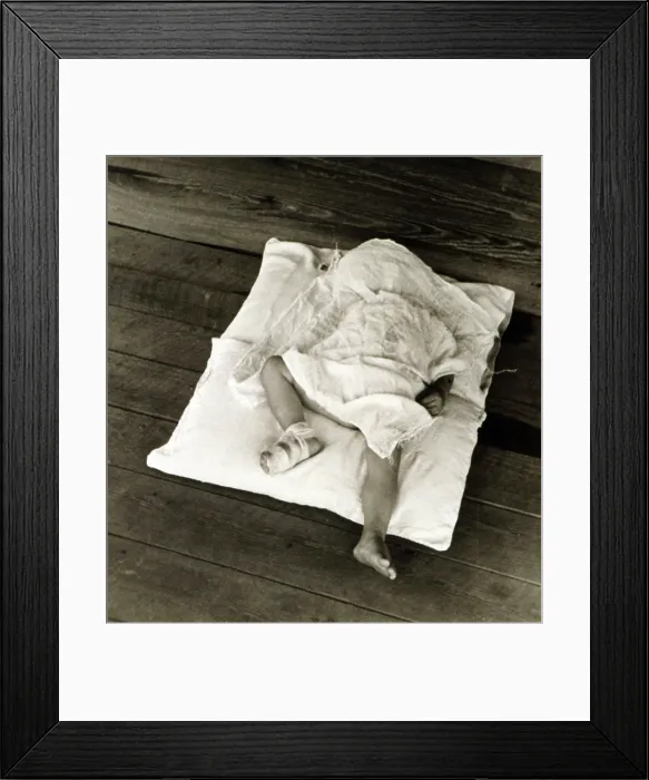 Framed Print : Squeakie asleep. Othel Lee, known as Squeakie, son of Floyd Burroughs, sharecropper. Hale County, Alabama. Published in the book, Let Us Now Praise Famous Men