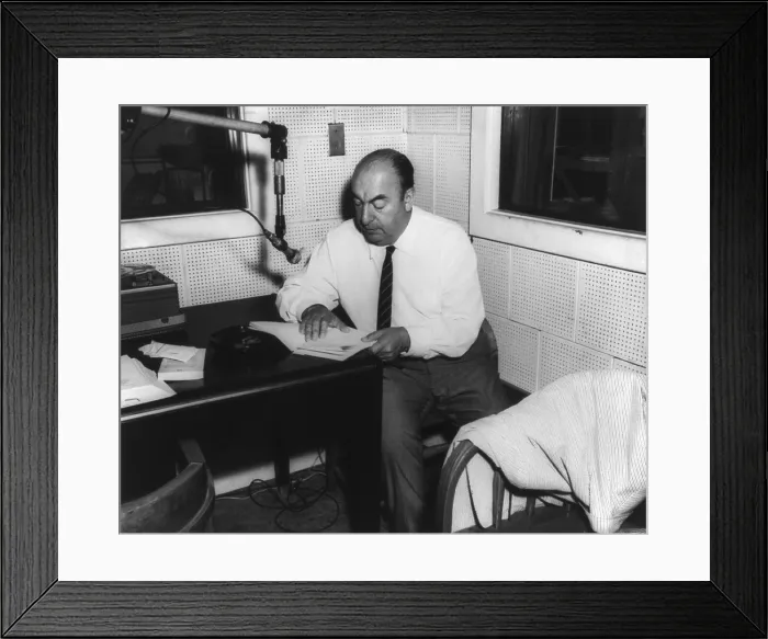 Framed Print : Pablo Neruda (1904-1973), Chilean poet, awarded the Nobel Prize for Literature in 1971. Photo shows Neruda in the Library of Congress recording studio. Ca. 1950s