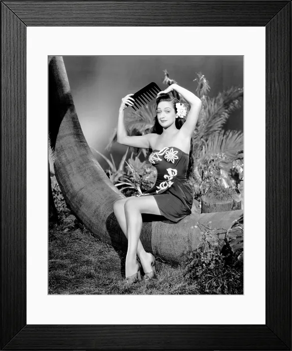 Framed Print : ON OUR MERRY WAY, Dorothy Lamour, with an oversized comedy comb, 1948