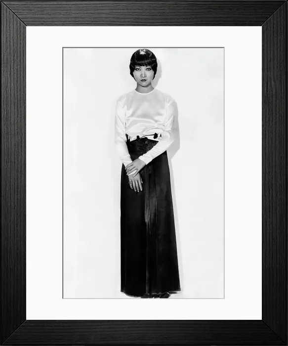 Framed Print : SHANGHAI EXPRESS, Anna May Wong, in brown-and-white satin pajamas by Travis Banton, 1932