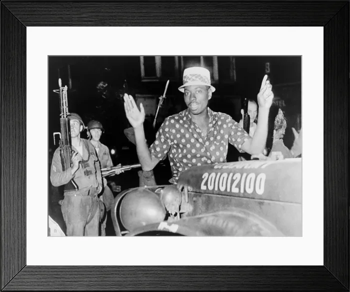 Framed Print : African American man with arms raised in the riot-torn Hough Avenue section of Cleveland, Ohio