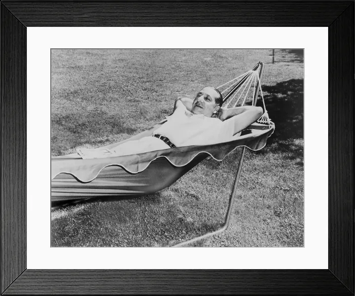 Framed Print : Frank Costello (1891-1973), Italian born gangster and close associate of mob boss Lucky Luciano, lying in a hammock, at his estate at Sands Point in 1950