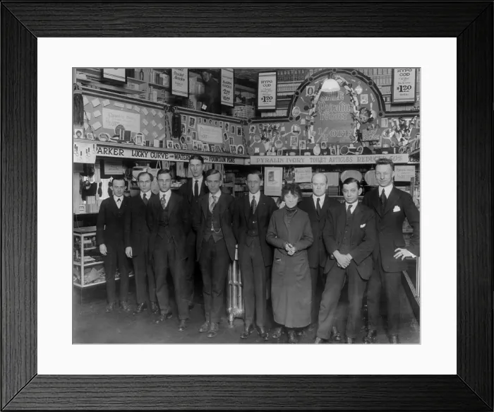 Framed Print : Drug store, nine men and a woman posed in a drug store, original title: Peoples Drug Store employees, Washington DC, 1920 Framed Print : Drug store, nine men and a woman posed in a drug store, original title: Peoples Drug Store employees, Washington DC, 1920