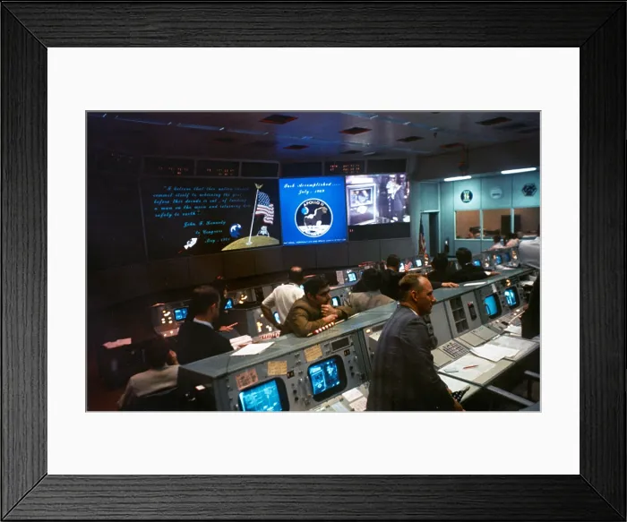 Framed Print : NASA Mission Control during Apollo 11 moon mission. Monitors show President Richard Nixon greeting the astronauts aboard the USS Hornet. July 24, 1969