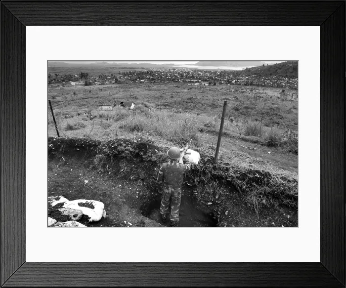Framed Print : CONGO, Democratic Republic of the. NORTH KIVU. Democratic Republic of the Congo (2008). Kivu Conflict. Indian sodier of the UN forces watching over the city of Sake from a trench Framed Print : CONGO, Democratic Republic of the. NORTH KIVU. Democratic Republic of the Congo (2008). Kivu Conflict. Indian sodier of the UN forces watching over the city of Sake from a trench