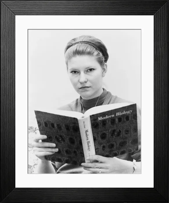 Framed Print : Susan Epperson, the plaintiff in Epperson v. Arkansas, 393 U.S. 97 (1968), holding biology textbook. The U.S