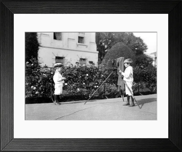Framed Print : President Theodore Roosevelt's younger sons, Archie (1894-1979) and Quentin (1897-1918), are playing with camera during a White House photo opportunity
