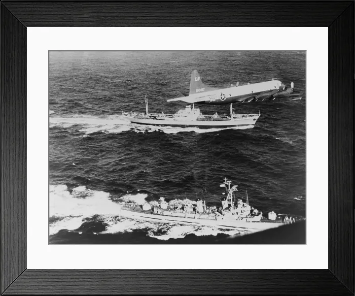 Framed Print : Soviet freighter ANESOV, escorted by a United States Navy plane and the destroyer, USS BARRY, as it leaves Cuba loaded with missiles signaling the end of Cuban Missile Crisis