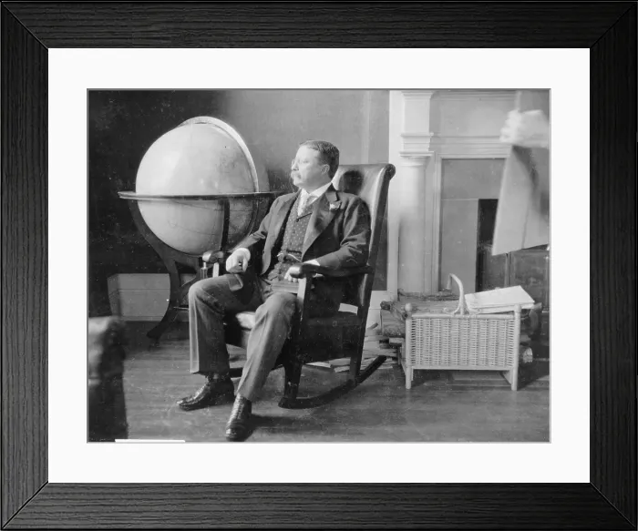 Framed Print : Theodore Roosevelt, at the end of his presidency, seated in rocking chair, by large globe. During Roosevelt's presidency, the United States was recognized as a world power Framed Print : Theodore Roosevelt, at the end of his presidency, seated in rocking chair, by large globe. During Roosevelt's presidency, the United States was recognized as a world power