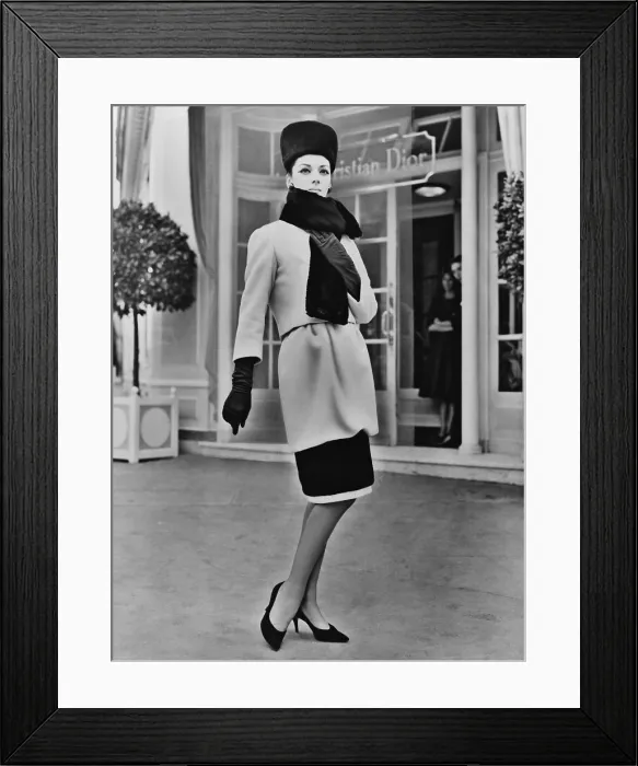 Framed Print : French designer, Christian Dior included a short hobble skirt in his 1959 collection. The design was accented by black seal, and worn with gloves and a high pillbox hat Framed Print : French designer, Christian Dior included a short hobble skirt in his 1959 collection. The design was accented by black seal, and worn with gloves and a high pillbox hat