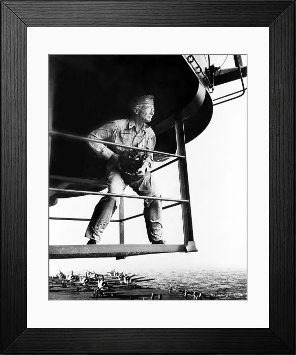 Framed Print : Lt. Commander Edward Steichen (1879-1973) holding camera, standing on aircraft carrier during WWII in 1945