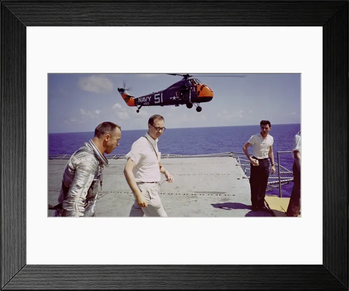 Framed Print : Astronaut Alan B. Shepard on the deck of the aircraft carrier, U.S.S. Lake Champlain, after the recovery of his Freedom 7 Mercury space capsule. May 5, 1961