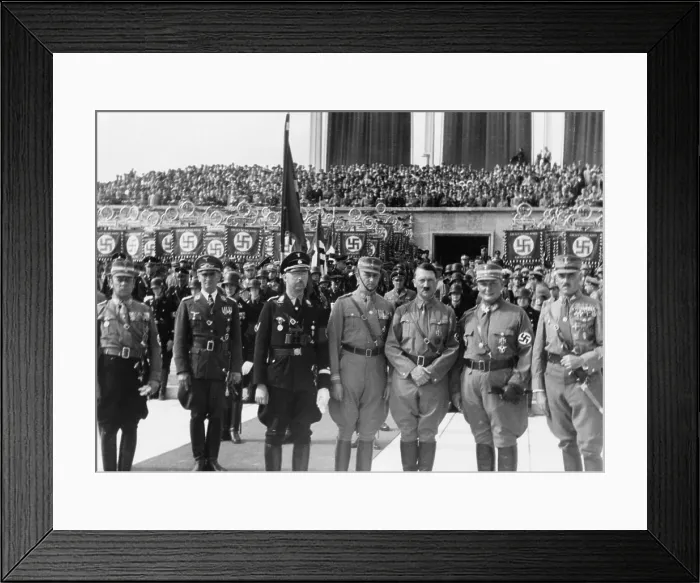 Framed Print : Adolf Hitler posed with Heinrich Himmler (third from left), Hermann Goring (second from right), and other Nazi officers in front of crowd, celebrating the Day of the Storm Troops Framed Print : Adolf Hitler posed with Heinrich Himmler (third from left), Hermann Goring (second from right), and other Nazi officers in front of crowd, celebrating the Day of the Storm Troops
