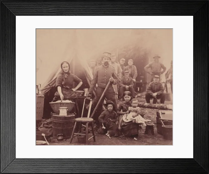 Framed Print : The Civil War, woman with sleeves rolled up holding basket, in front of tent with a soldier (possibly her husband) and three children, other soldiers in the background Framed Print : The Civil War, woman with sleeves rolled up holding basket, in front of tent with a soldier (possibly her husband) and three children, other soldiers in the background