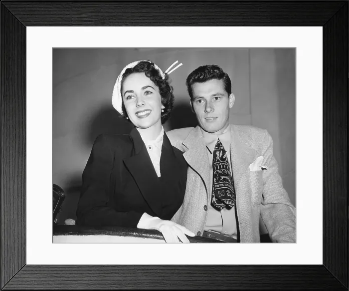 Framed Print : Mr. and Mrs. Conrad Hilton sailing on the Queen Mary for an extended European Honeymoon. May 24, 1950. Nicky Hilton remained Elisabeth Taylor's husband for less than 8 months Framed Print : Mr. and Mrs. Conrad Hilton sailing on the Queen Mary for an extended European Honeymoon. May 24, 1950. Nicky Hilton remained Elisabeth Taylor's husband for less than 8 months