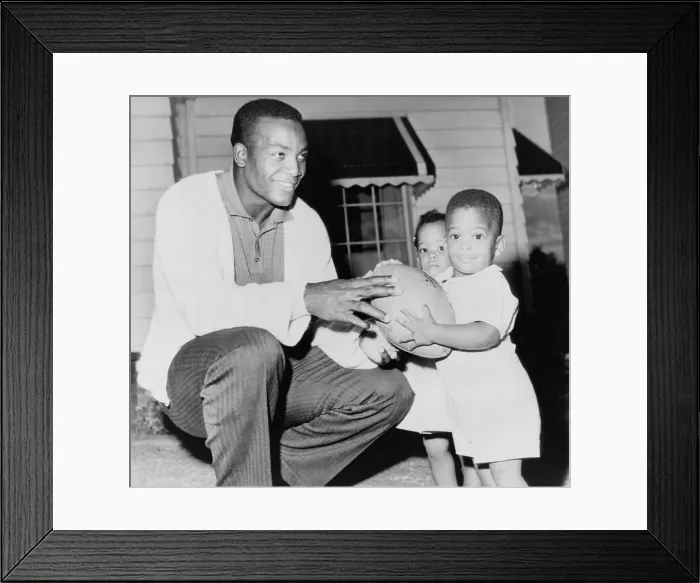 Framed Print : Jim Brown, at the beginning of his professional football career with his twins, Kevin and Kim. Sept. 27, 1961
