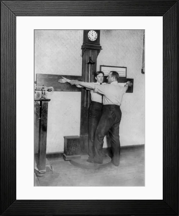 Framed Print : New York City, police department activities, taking bertillon measurements of the armspan, photograph, 1908
