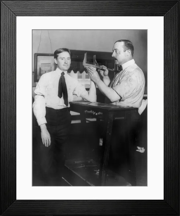 Framed Print : New York City, police department activities, taking bertillon measurements of hand size, photograph, 1908