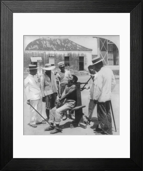 Framed Print : Paying the death penalty for crime, garroting a criminal at Bilibid Prison, Manila, Philippine Islands, 1901