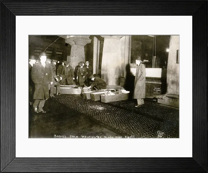 Framed Print : Bodies from Triangle Shirtwaist fire. City officials placing Triangle Shirtwaist Company fire victims in coffins. March 25, 1911