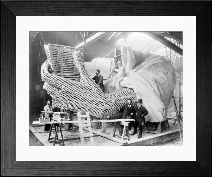 Framed Print : Frederic-Auguste Bartholdi (1834-1904), the French creator of the Statue of Liberty, explains the inner construction of the Hand section of the statue to a visitor Framed Print : Frederic-Auguste Bartholdi (1834-1904), the French creator of the Statue of Liberty, explains the inner construction of the Hand section of the statue to a visitor