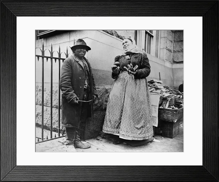 Framed Print : New York City street types: Emigrant man and women pretzel vendor. 1896 photograph by Alice Austen