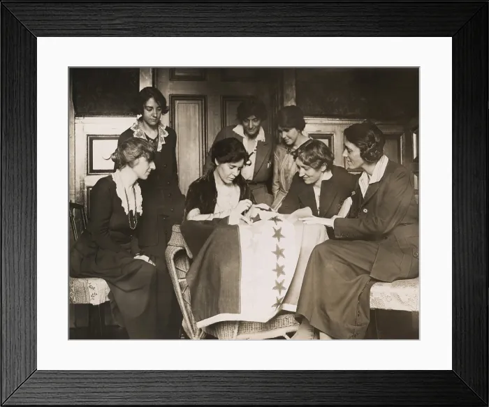 Framed Print : National Woman's Party activists watch Alice Paul sew a star onto the NWP Ratification Flag, representing another state's ratification of the 19th Amendment Framed Print : National Woman's Party activists watch Alice Paul sew a star onto the NWP Ratification Flag, representing another state's ratification of the 19th Amendment