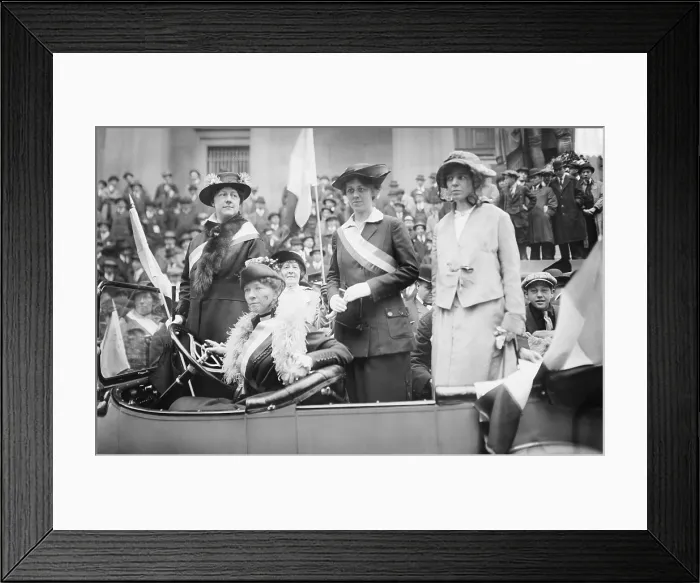 Framed Print : Prominent woman's suffrage advocates parade in an open car supporting the ratification of the 19th amendment granting women the right to vote in federal elections