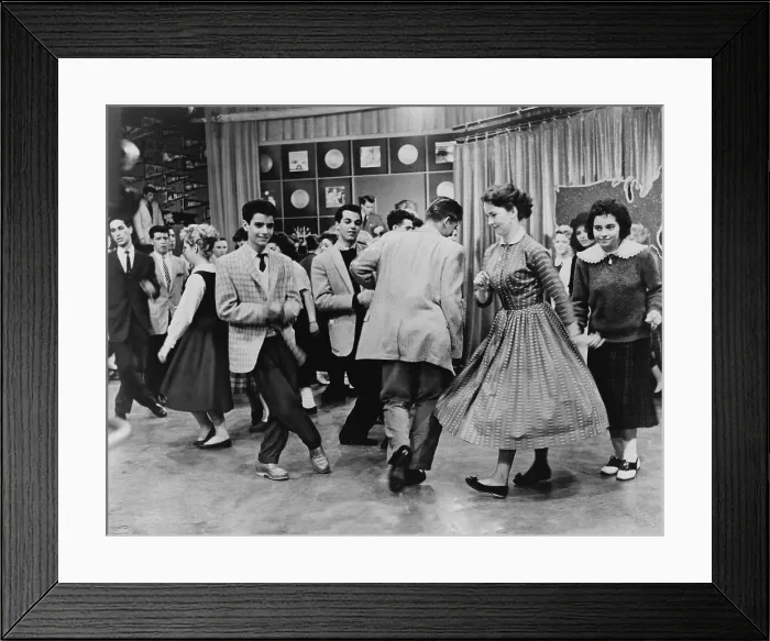 Framed Print : Teens dancing on Dick Clark's American Bandstand in 1961. Some are dancing the Twist, recently popularized by Chubby Checker's 1960 single, The Twist Framed Print : Teens dancing on Dick Clark's American Bandstand in 1961. Some are dancing the Twist, recently popularized by Chubby Checker's 1960 single, The Twist