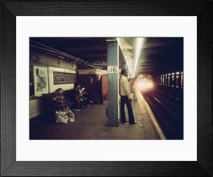 Framed Print : New York City Subway. Passengers wait on a subway platform on the Lexington Avenue line at 86th Street as a train approaches. CA. 1972-75 Framed Print : New York City Subway. Passengers wait on a subway platform on the Lexington Avenue line at 86th Street as a train approaches. CA. 1972-75