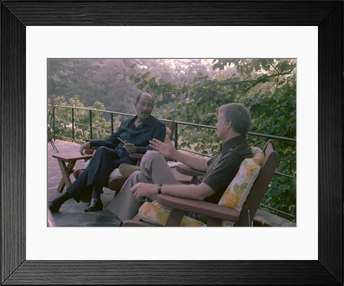 Framed Print : Anwar Sadat and Jimmy Carter at Camp David talking outdoors during the marathon summit that resulted in the Camp David Accords. Sept 5-17 1978