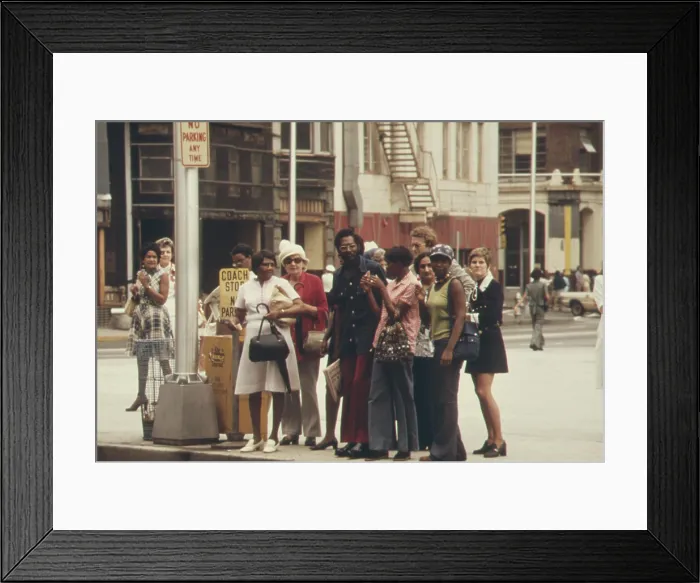 Framed Print : Integrated group of commuters waiting on a street corner for the city bus in Atlanta Georgia. Ca. 1975 Framed Print : Integrated group of commuters waiting on a street corner for the city bus in Atlanta Georgia. Ca. 1975