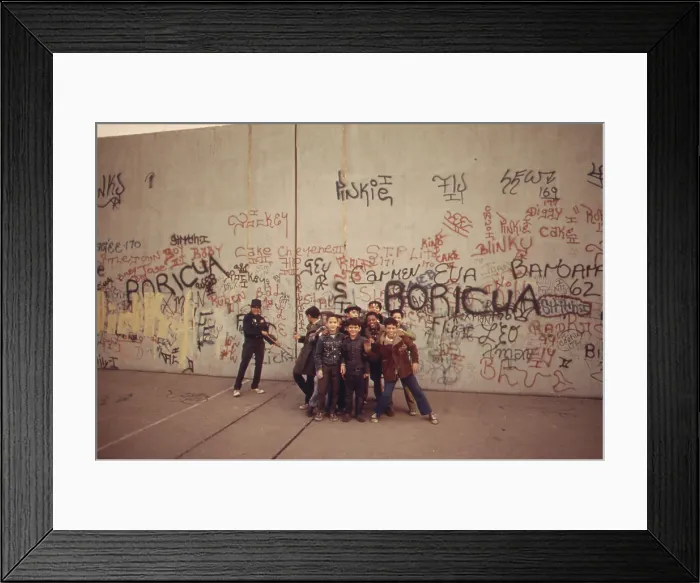 Framed Print : Multi-ethnic group of boys smile in front of a graffiti covered wall in the poor Bronx borough of New York City. Ca. 1975 Framed Print : Multi-ethnic group of boys smile in front of a graffiti covered wall in the poor Bronx borough of New York City. Ca. 1975