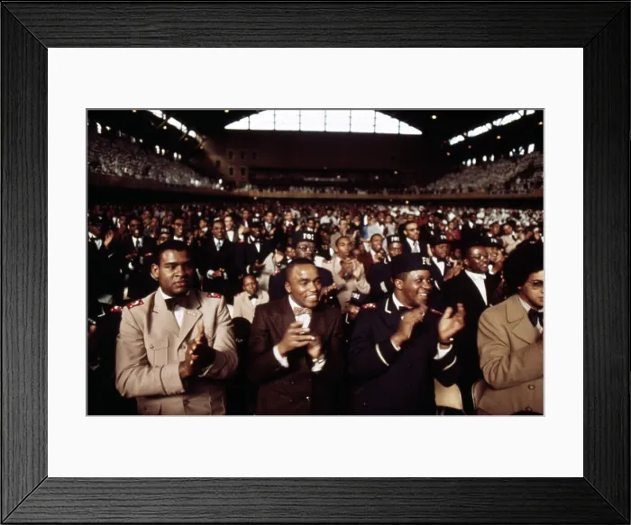 Framed Print : African American men applaud Black Muslim leader Elijah Muhammad during his Annual Savior's Day message in Chicago. March 1974