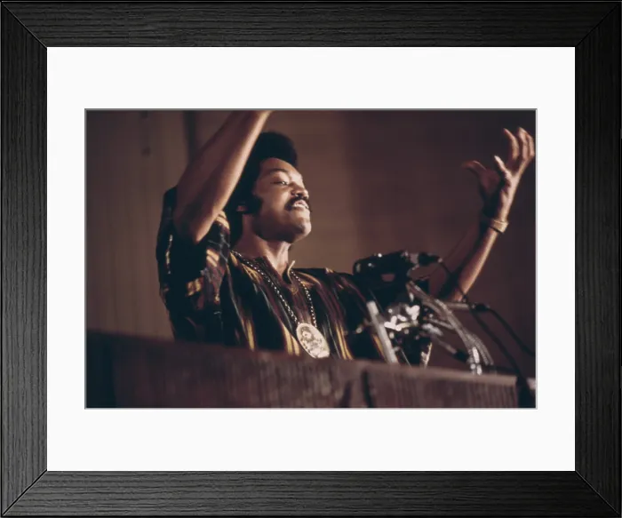 Framed Print : Jesse Jackson speaks on a radio broadcast from the headquarters of Operation Push during its annual convention July 1973