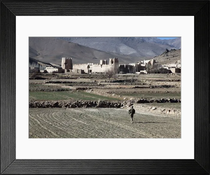 Framed Print : U.S. Soldier walks through a field to Dahanah village Wardak province Afghanistan. Dec. 2 2010. Photo by:Everett Collection(BSLOC_2011_6_62)