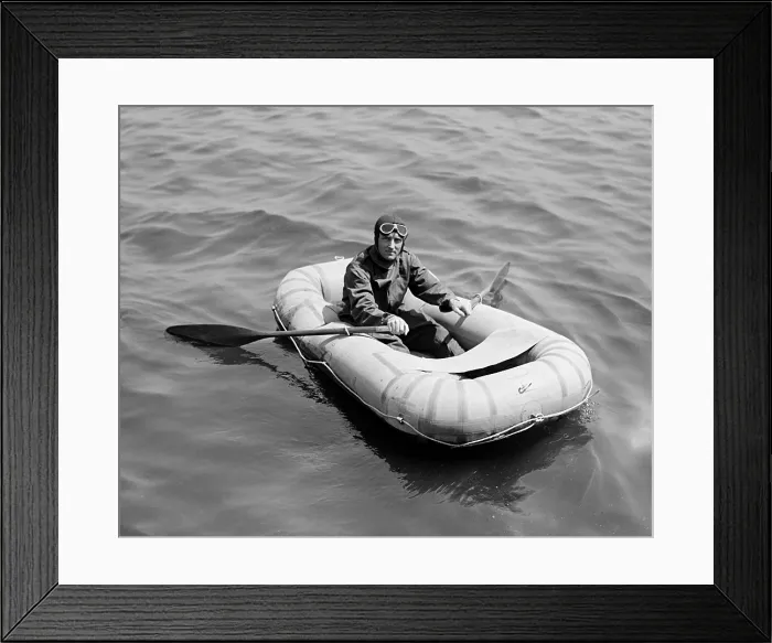 Framed Print : Richard E. Byrd (1888-1957) polar explorer who used aviation to explore Antarctica. In this 1925 photo Byrd tests a new safety device, the inflatable rubber life boat