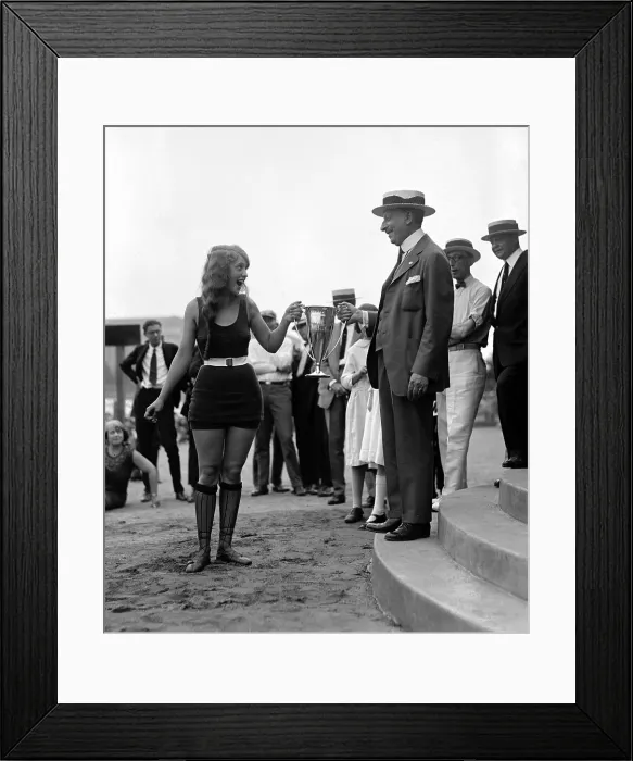 Framed Print : Excited winner of 1922 beach beauty contest receives her trophy in Washington, D.C