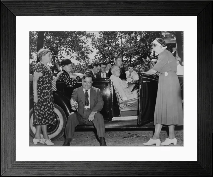 Framed Print : Franklin Roosevelt at the wheel of his specially outfitted car with notable guests. Left to right: Mrs