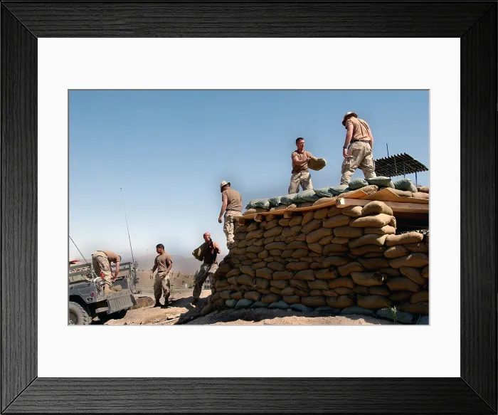 Framed Print : U.S. Army soldiers of the 101st Airborne Division reinforce the roof of a forward observation post with sandbags near Kabul Afghanistan