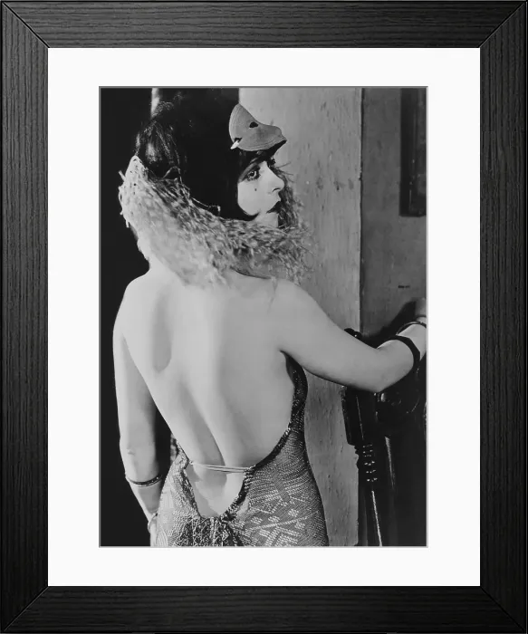 Framed Print : Clara Bow, (1905-1965) in a costume with very low cut back. 1920s